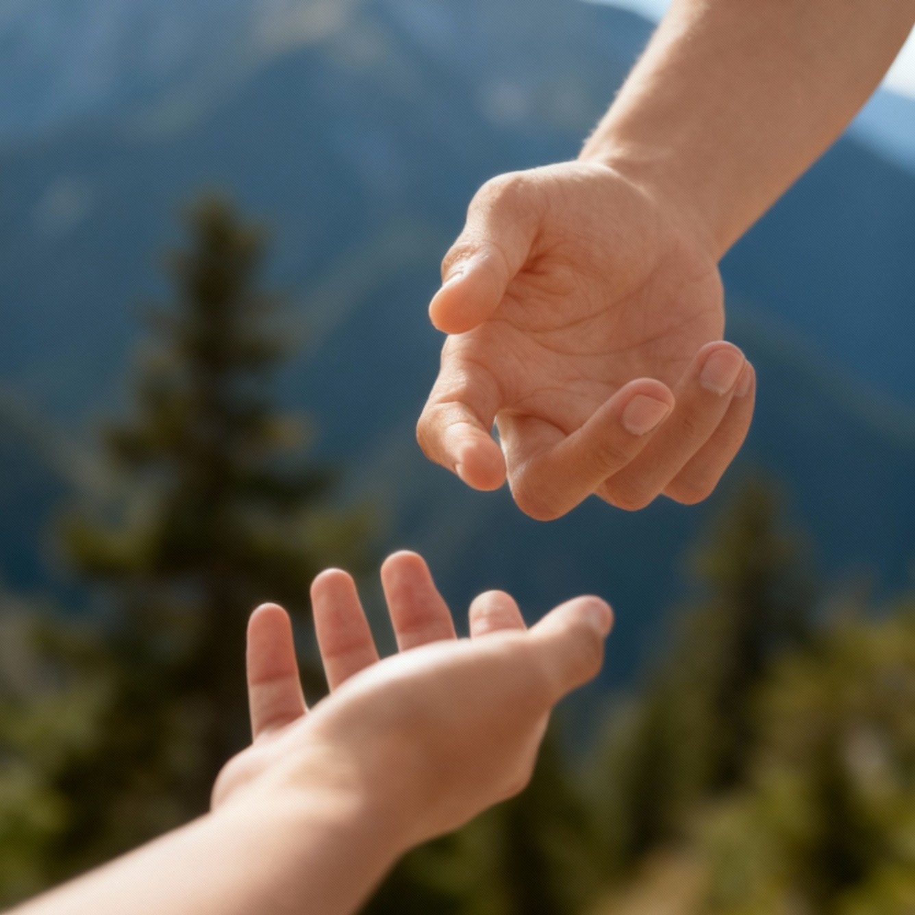 Two hands reaching out toward each other.