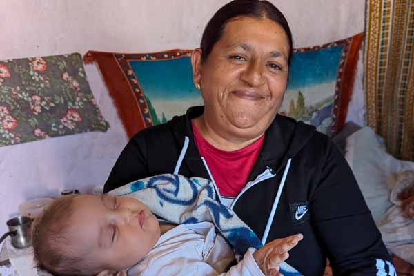 Village Lady With Her Grandchild