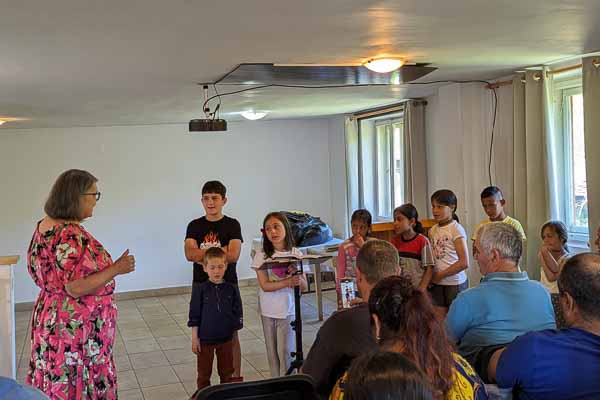 Children Sing During a Service